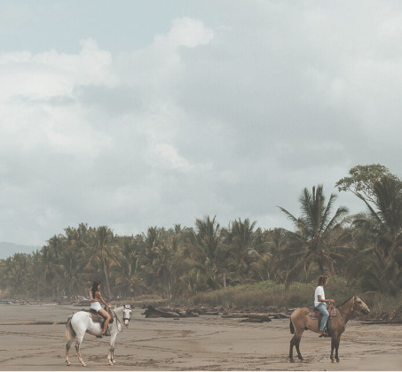 Horseback riders on a Costa Rica Pacific beach