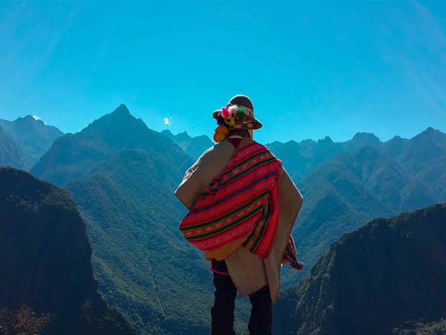 Quechua wisdom carrier overlooking the Sacred Valley of the Andes